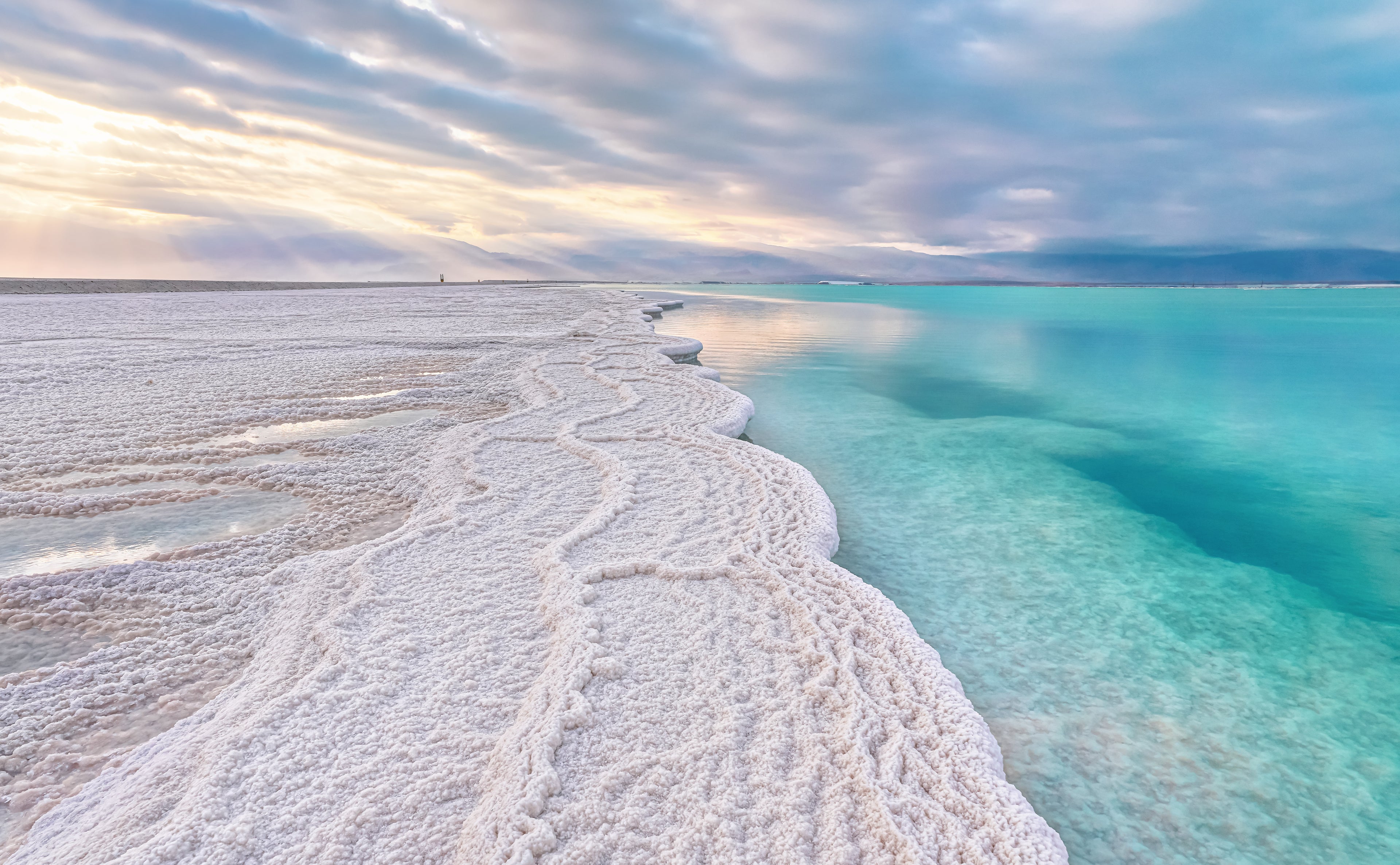 Dead Sea shoreline in Israel with turquoise water.